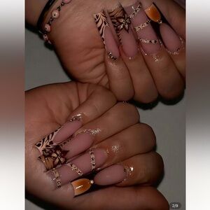 Elegant Nude and Black Nail Art with Rhinestones